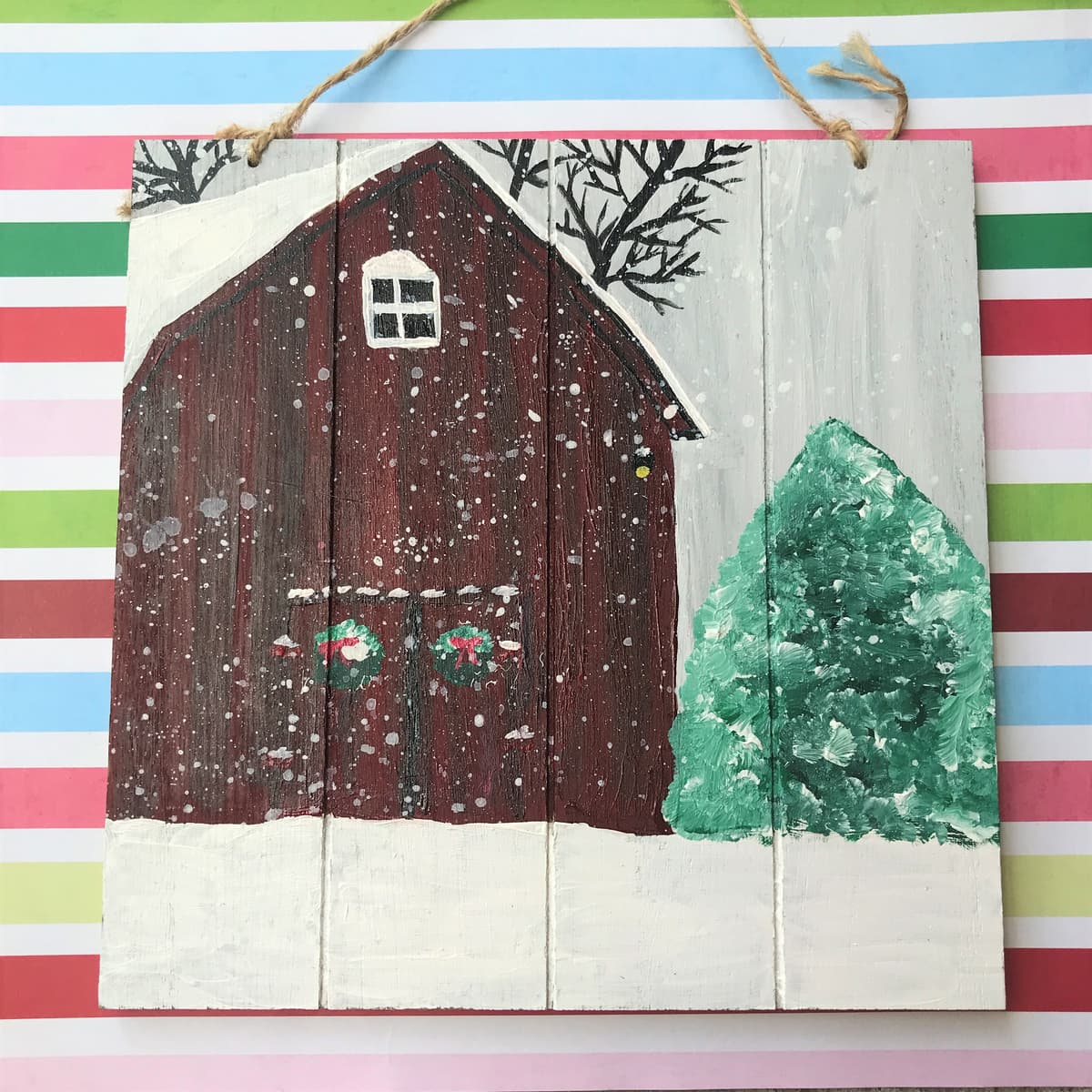 The selected image of Red Barn in the Snow Acrylic Painting on Wooden Sign