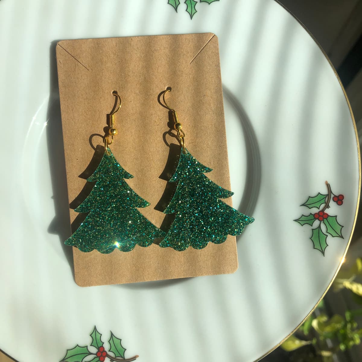 The selected image of Large Green Sparkly Acrylic Christmas Tree Dangle Earrings