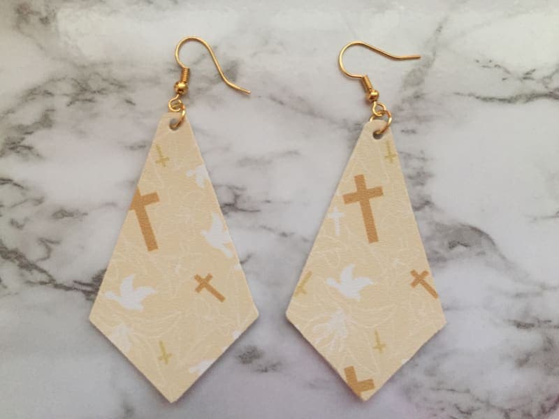 The selected image of Cream Cross and Dove Christian Rhombus Faux Leather Earrings