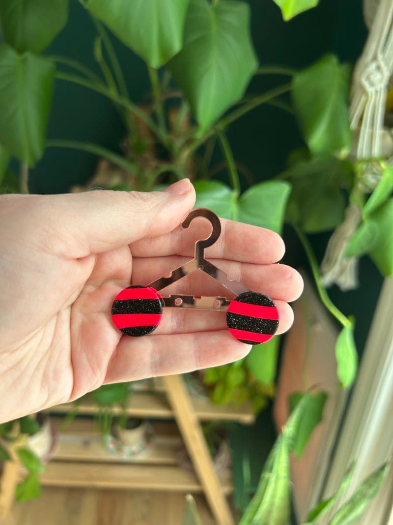 The selected image of Neon Pink and Sparkly Black Round Striped Studs