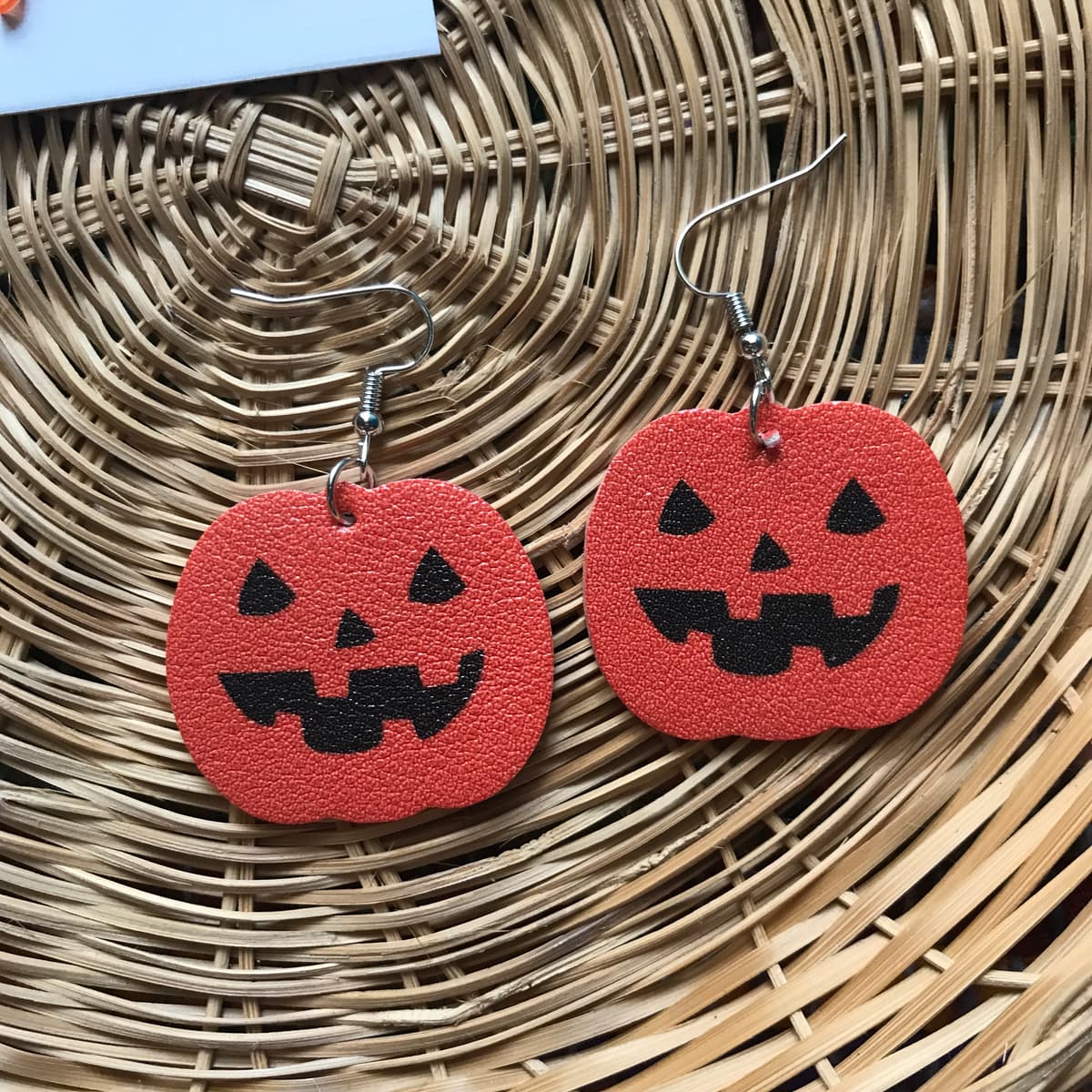 The selected image of Faux Leather Jack-o-Lantern Pumpkin Earrings
