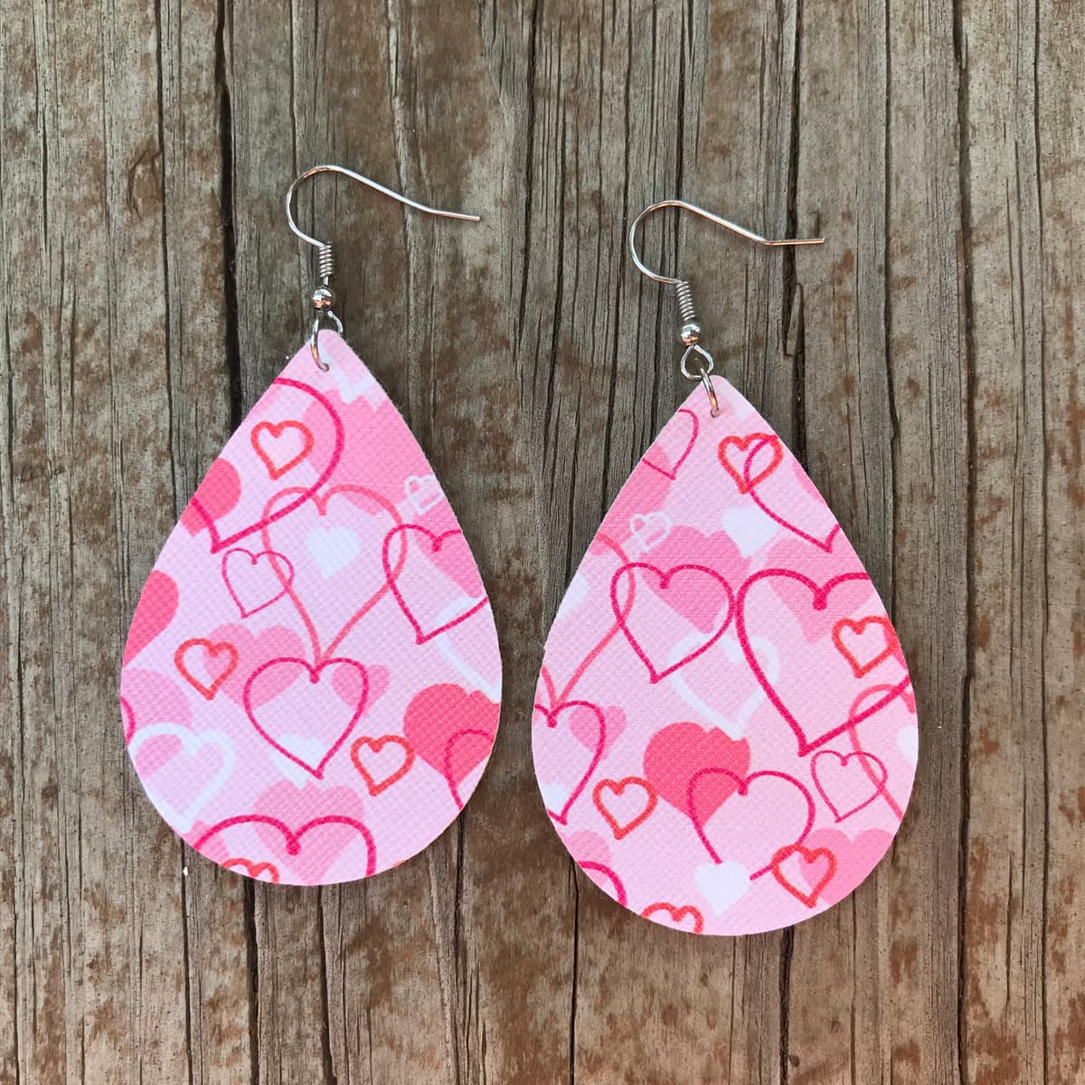 The selected image of Pink and Red Doodle Hearts Valentine's Day Faux Leather Earrings